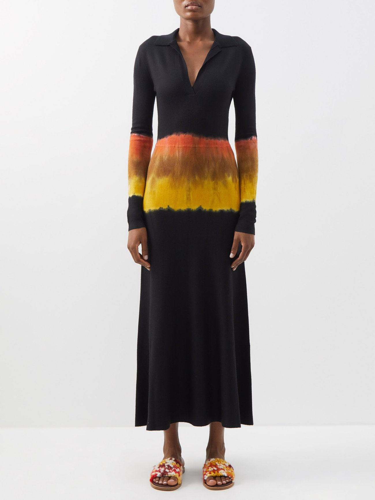 Knitted from a soft blend of cashmere and silk, Gabriela Hearst's black Beryl dress features sunset-inspired tie-dye around the middle for a bohemian note. Long sleeves and maxi length with a v neck and polo shirt collar. 