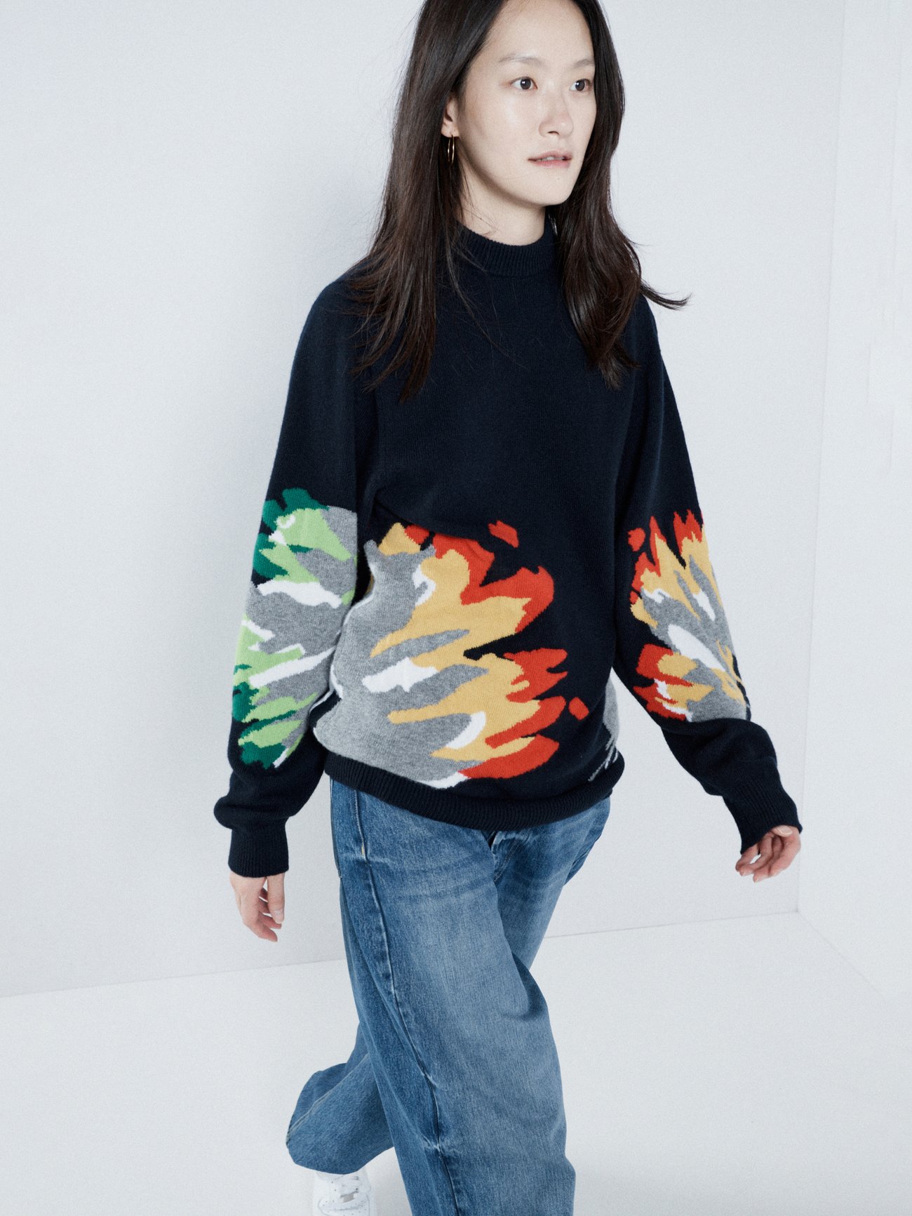 Raey’s navy oversized wool sweater is patterned with colour-blocking abstract tulips to give your looks a punchy finish.