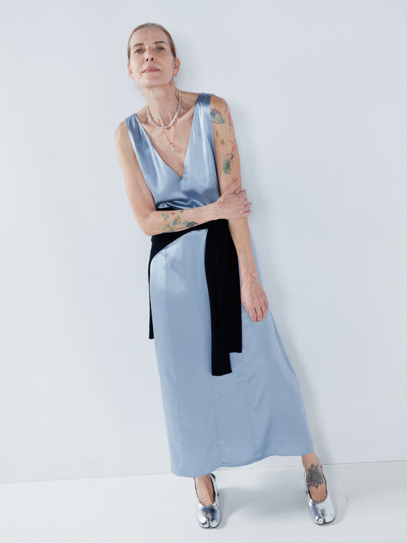 Draped to an oversized fit from lightweight silk satin, Raey's light blue slip dress is cut with a plunging neckline that falls to a relaxed hem.