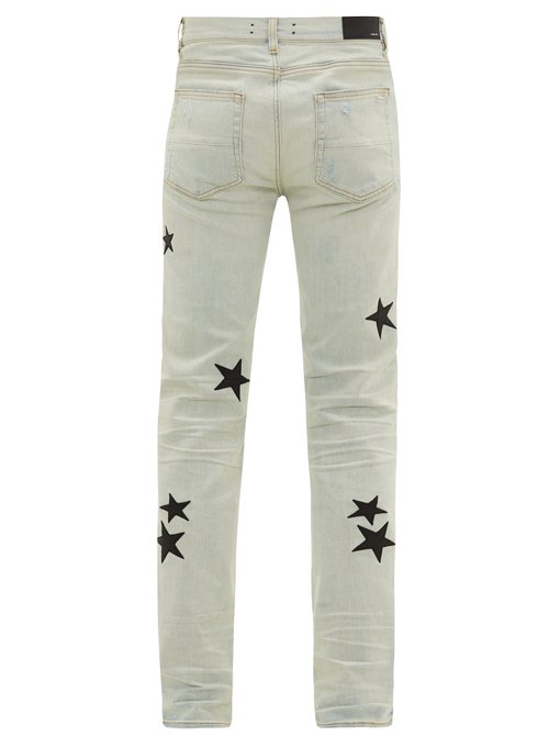 Leather star-appliqué cotton-blend jeans | Amiri | MATCHESFASHION US