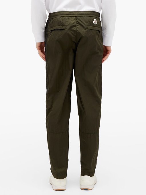 track pants with side buttons