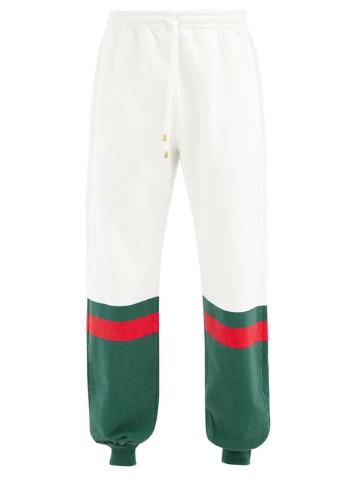 Gucci グッチ ロゴストライプ トラックパンツ Matchesfashion マッチズファッション