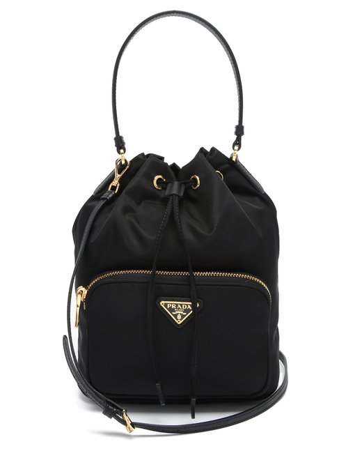 Triangle logo-plaque nylon bucket bag | Prada | MATCHESFASHION US