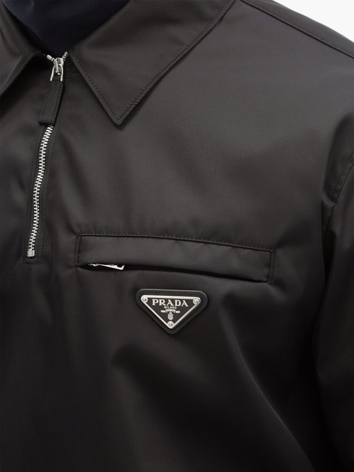 Triangle logo-plaque quarter-zip Re-Nylon jacket | Prada ...