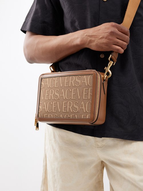 Versace Logo-jacquard Leather-trim Canvas Cross-body Bag In Tan