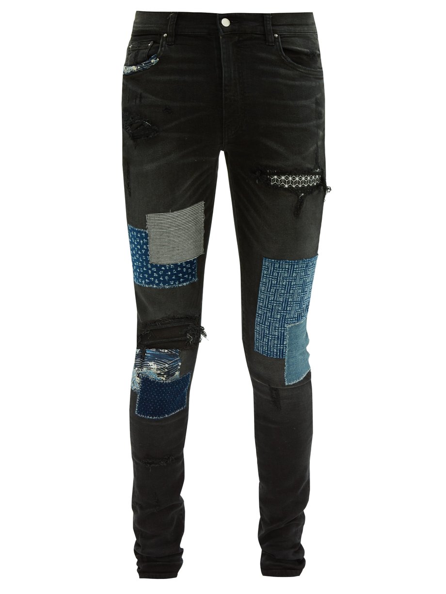Black Patchwork distressed slim-leg jeans | Amiri | MATCHESFASHION US