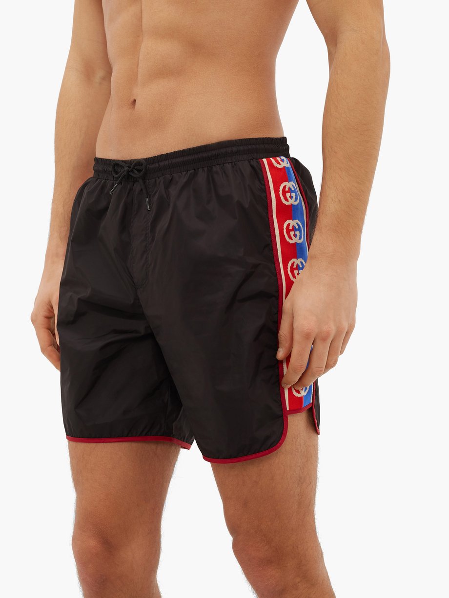 Black Logo-stripe swim shorts | Gucci | MATCHESFASHION US