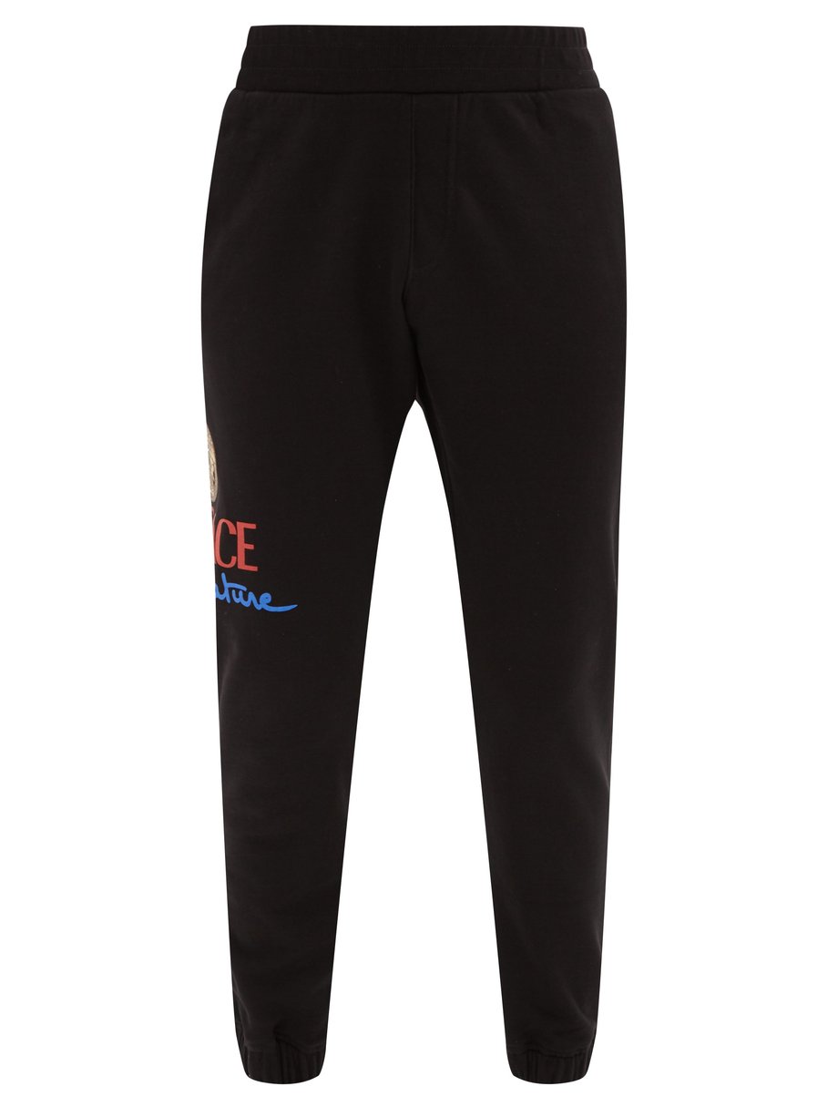 Versace Versace Logo-print cotton-jersey track pants Black ...