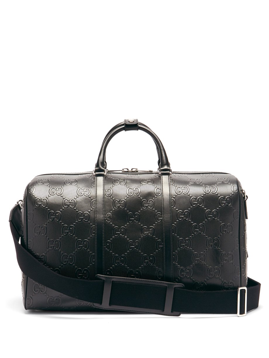 Black GG-monogram perforated-leather holdall | Gucci | MATCHESFASHION US