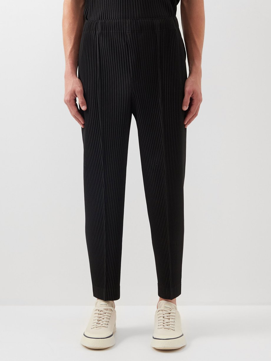 Homme Plissé Issey Miyake Black Technical pleated tapered-leg trousers ...