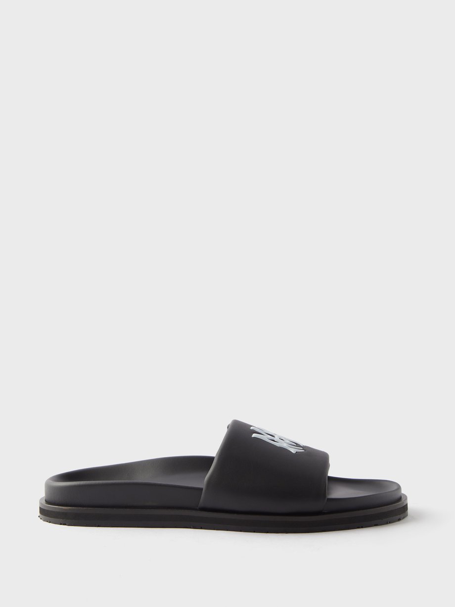 Amiri Black Logo-embossed leather slides | 매치스패션, 모던 럭셔리 온라인 쇼핑