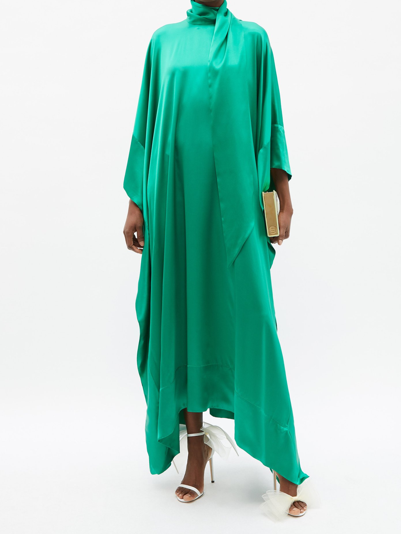 Taller Marmo's 1970s-style green New Age kaftan is cut from generous billows of green silk-satin, creating a ripple and flow of movement with every step.